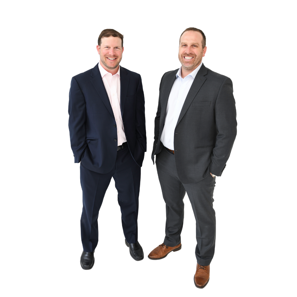 photo of two men in suits smiling